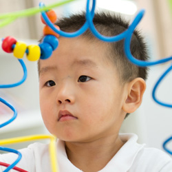 boy looking at toy