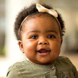 infant girl smiling