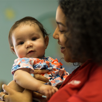 teacher holding baby